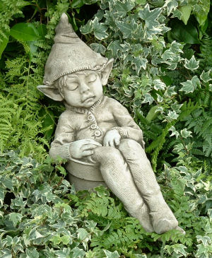 Joe: a sleeping pixie statue sculpture for the garden